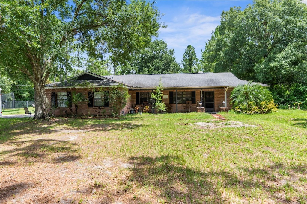 ranch-style house with a front lawn