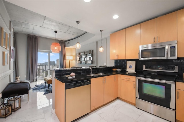 kitchen with kitchen peninsula, light brown cabinetry, stainless steel appliances, and hanging light fixtures