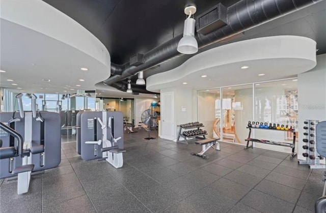 workout area featuring floor to ceiling windows