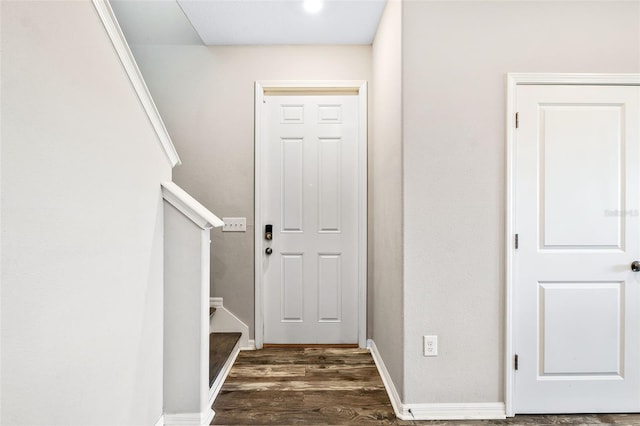 doorway with dark hardwood / wood-style floors