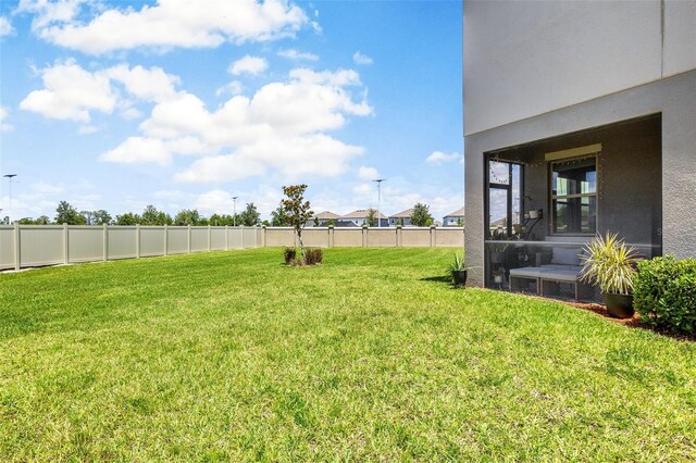 view of yard featuring a sunroom