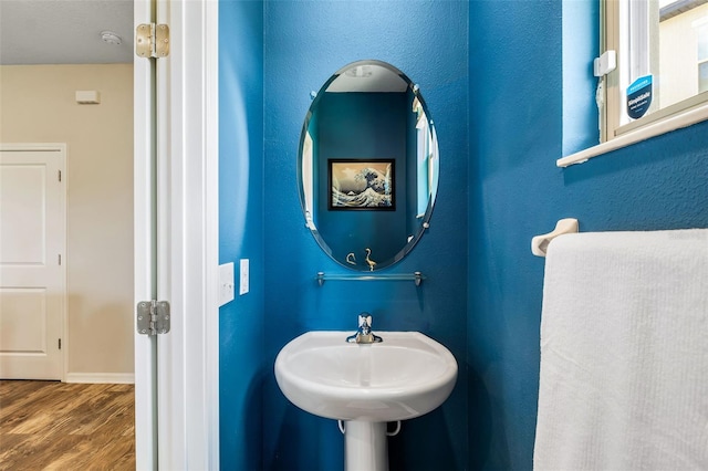 bathroom with sink and hardwood / wood-style floors