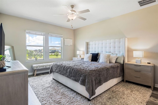 bedroom with ceiling fan and hardwood / wood-style floors