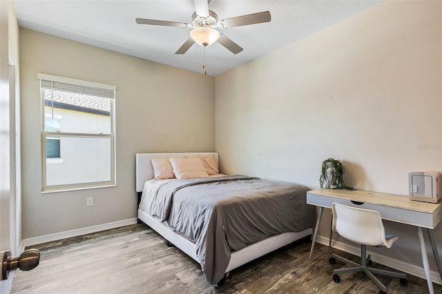 bedroom featuring ceiling fan and hardwood / wood-style floors