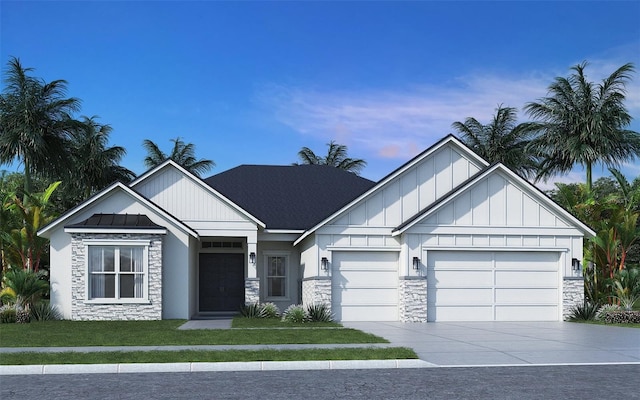 view of front of home featuring a garage and a yard