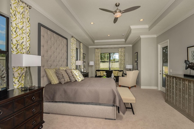 carpeted bedroom with a raised ceiling, ceiling fan, and crown molding