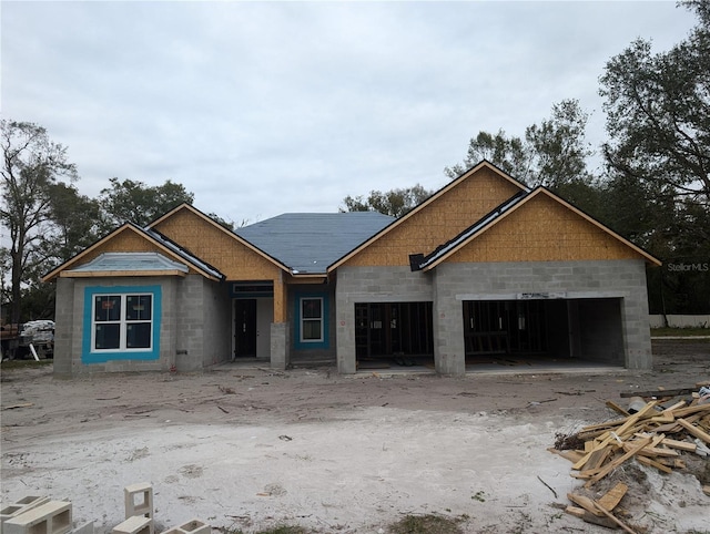 unfinished property with a garage