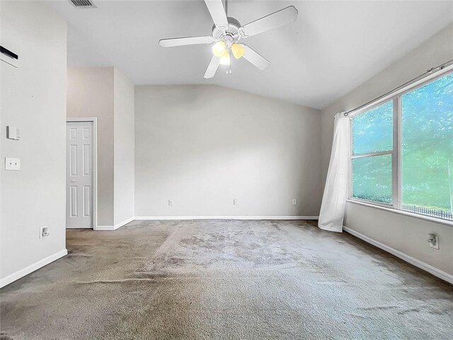 unfurnished room with vaulted ceiling, carpet flooring, and ceiling fan