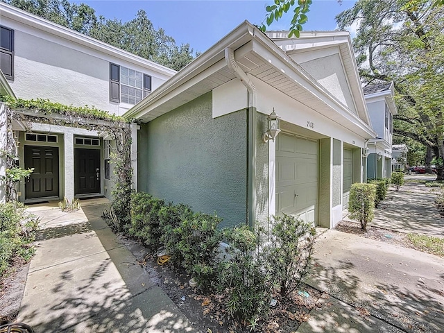 view of exterior entry featuring a garage