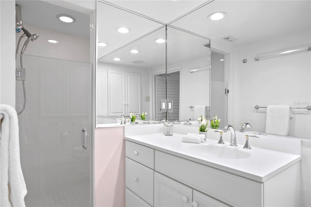 bathroom with vanity and walk in shower