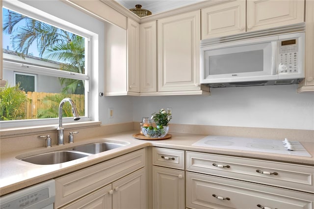 kitchen with white appliances and sink