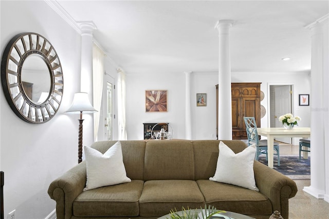 living room featuring crown molding and decorative columns