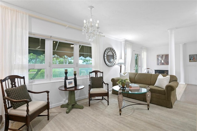 living room with a notable chandelier and ornate columns