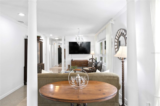 living room featuring ornate columns, ornamental molding, and a notable chandelier