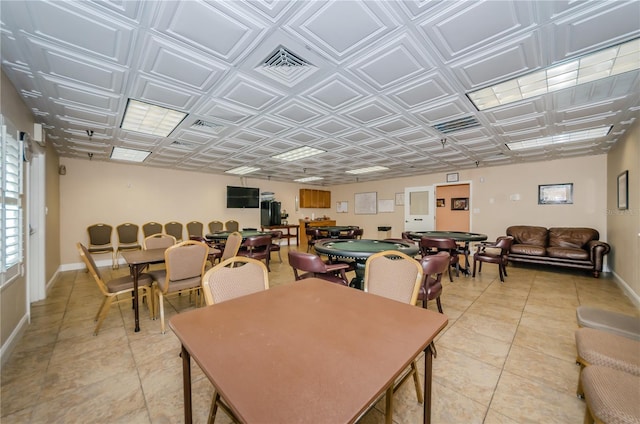 dining area with visible vents, light tile patterned floors, an ornate ceiling, and baseboards