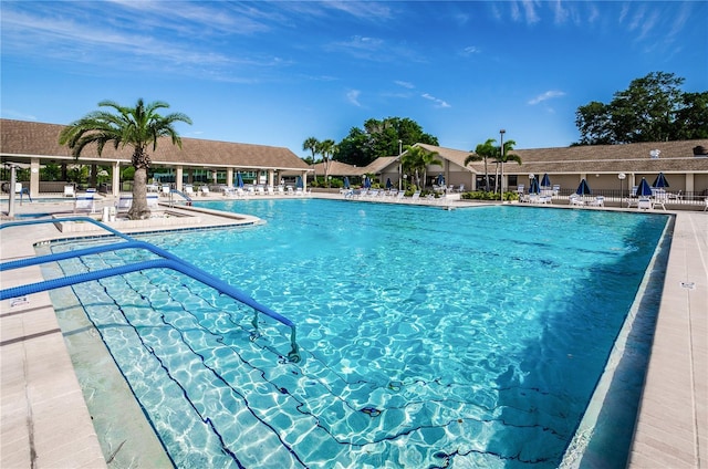 pool featuring a patio and fence