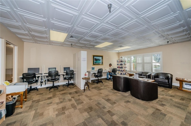 carpeted home office featuring an ornate ceiling and baseboards