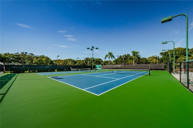 view of sport court with fence