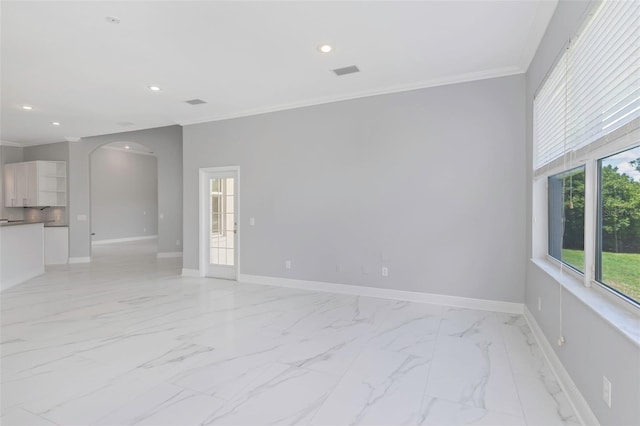 unfurnished room featuring crown molding