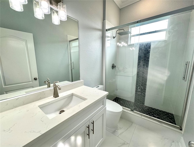 bathroom with vanity, toilet, and an enclosed shower