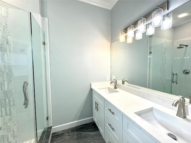 bathroom with vanity, a shower with shower door, and ornamental molding