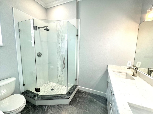 bathroom with a shower with door, vanity, ornamental molding, and toilet