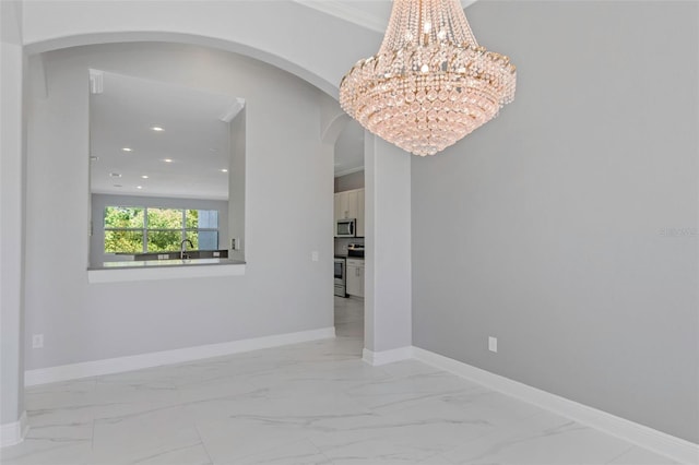 6218 Bridleford Dr, Wesley Chapel, FL 33545 - unfurnished room with arched walkways, marble finish flooring, a chandelier, baseboards, and recessed lighting