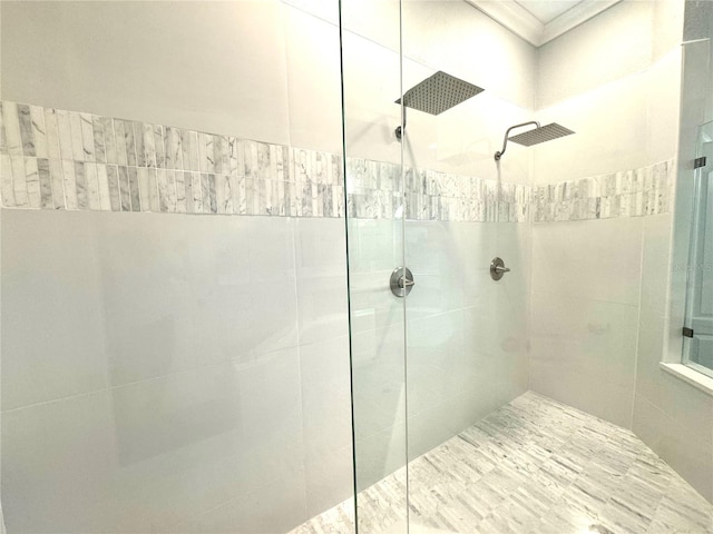 bathroom with a tile shower