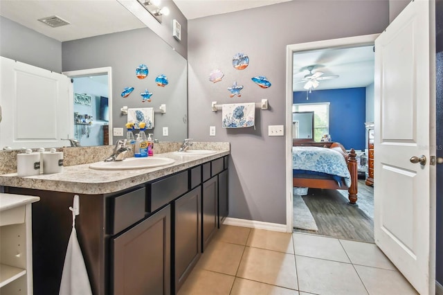 bathroom with ceiling fan, tile patterned floors, and vanity