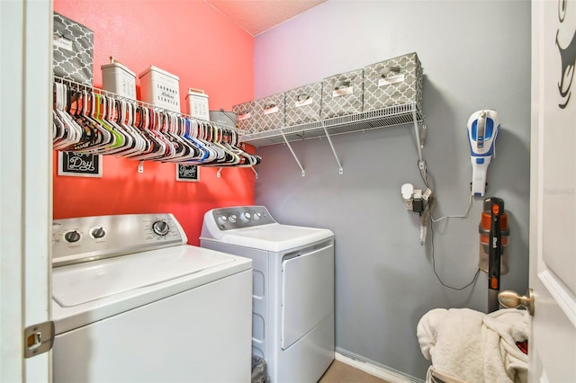 laundry room featuring washing machine and clothes dryer