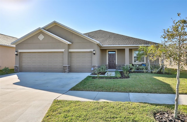 view of front of home with a garage and a front lawn