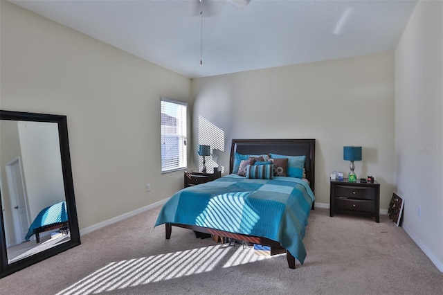 bedroom with ceiling fan and light carpet