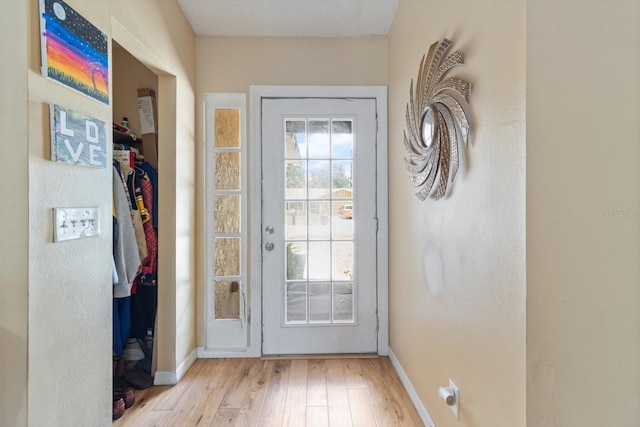 doorway with light hardwood / wood-style floors