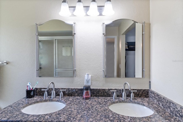 bathroom featuring dual bowl vanity