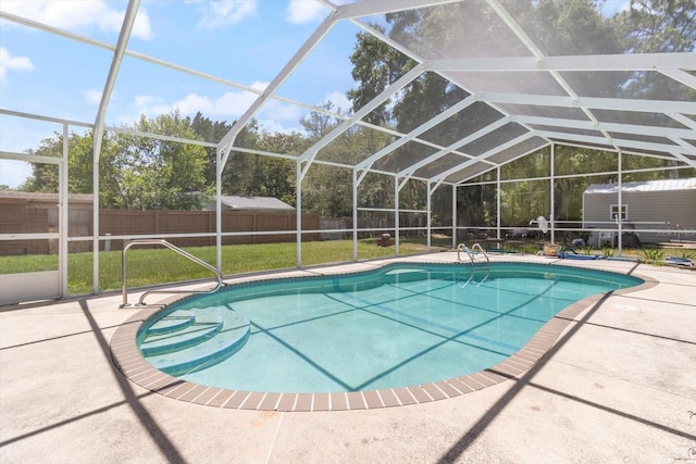 view of pool with a patio, a lanai, and a yard