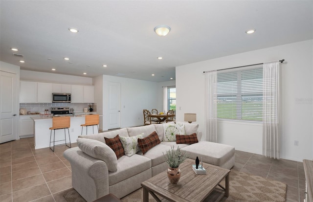 living room featuring light tile patterned floors