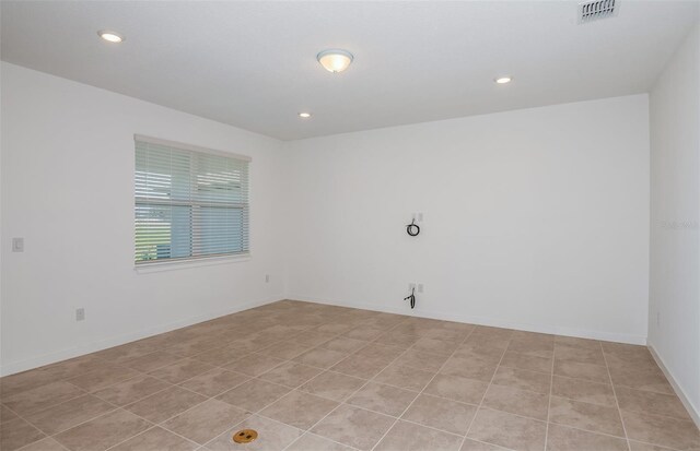 empty room with light tile patterned flooring