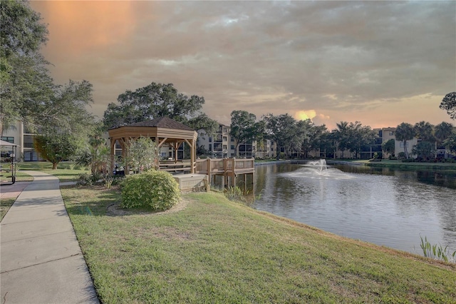 exterior space with a water view and a gazebo