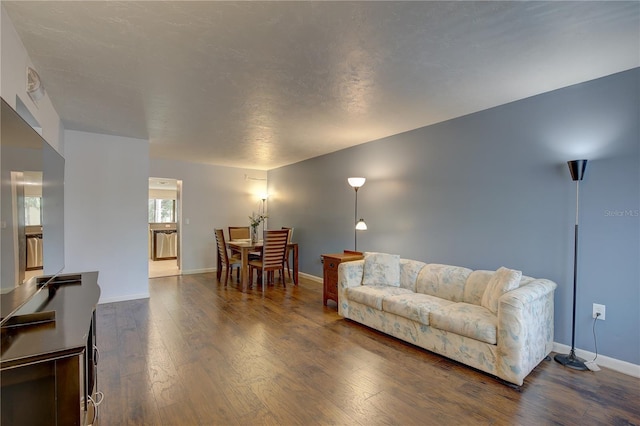 living room with dark hardwood / wood-style floors