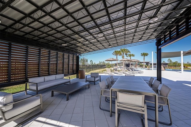 view of patio featuring outdoor lounge area and a pool