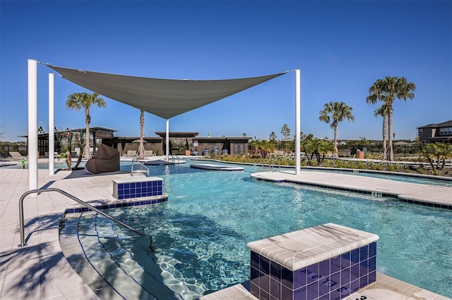 view of swimming pool with a patio area