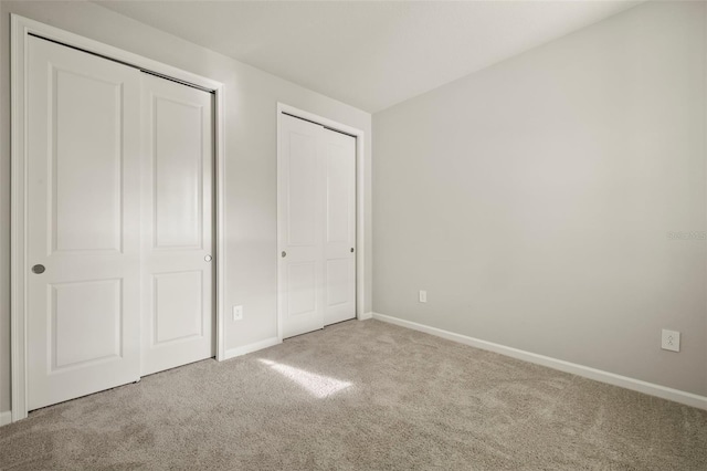 unfurnished bedroom featuring carpet