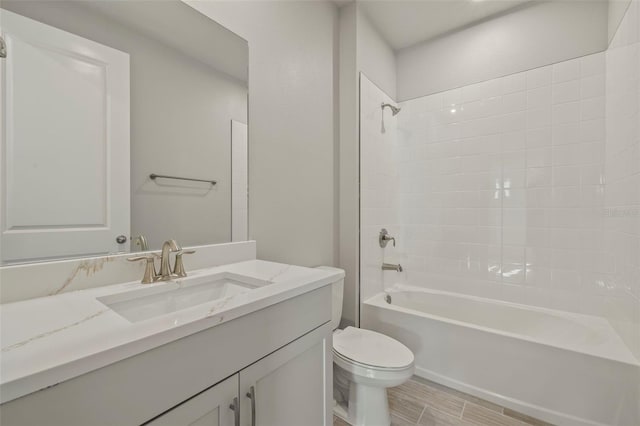 full bathroom featuring vanity, shower / bath combination, and toilet