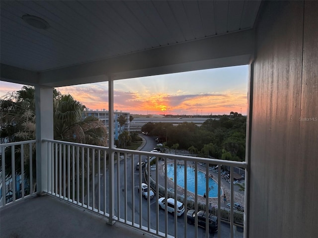 view of balcony at dusk