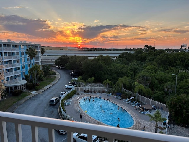 view of pool at dusk