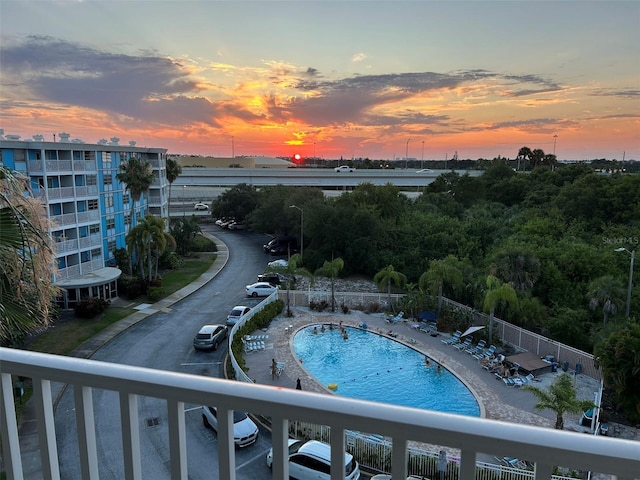 view of pool at dusk