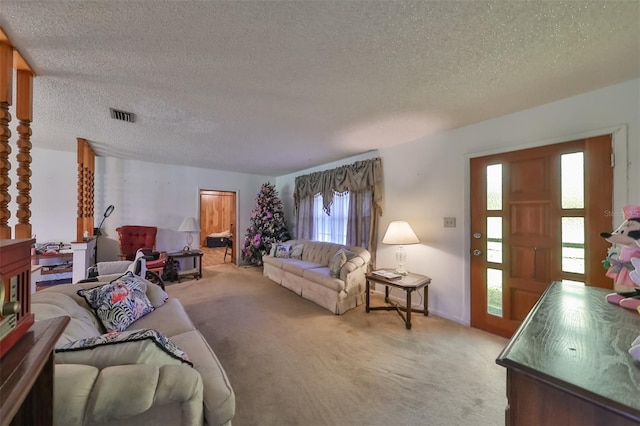 living room featuring carpet flooring and a textured ceiling