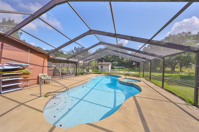 view of swimming pool featuring glass enclosure, an in ground hot tub, and a patio area