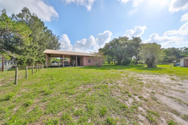 view of yard with an attached carport