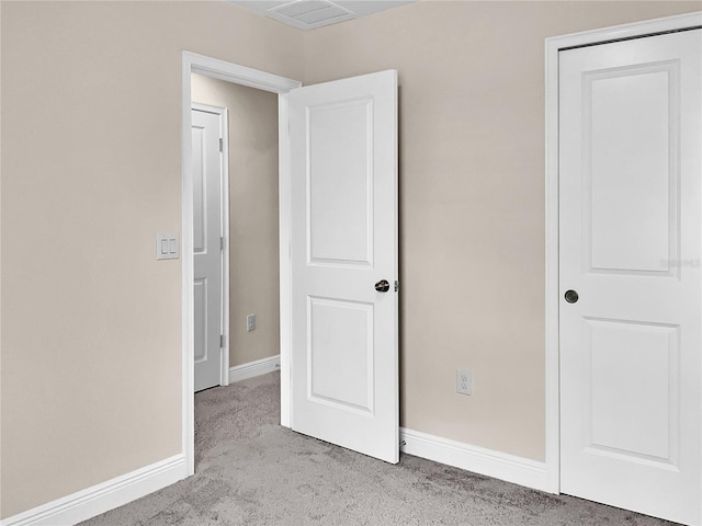 unfurnished bedroom featuring light colored carpet